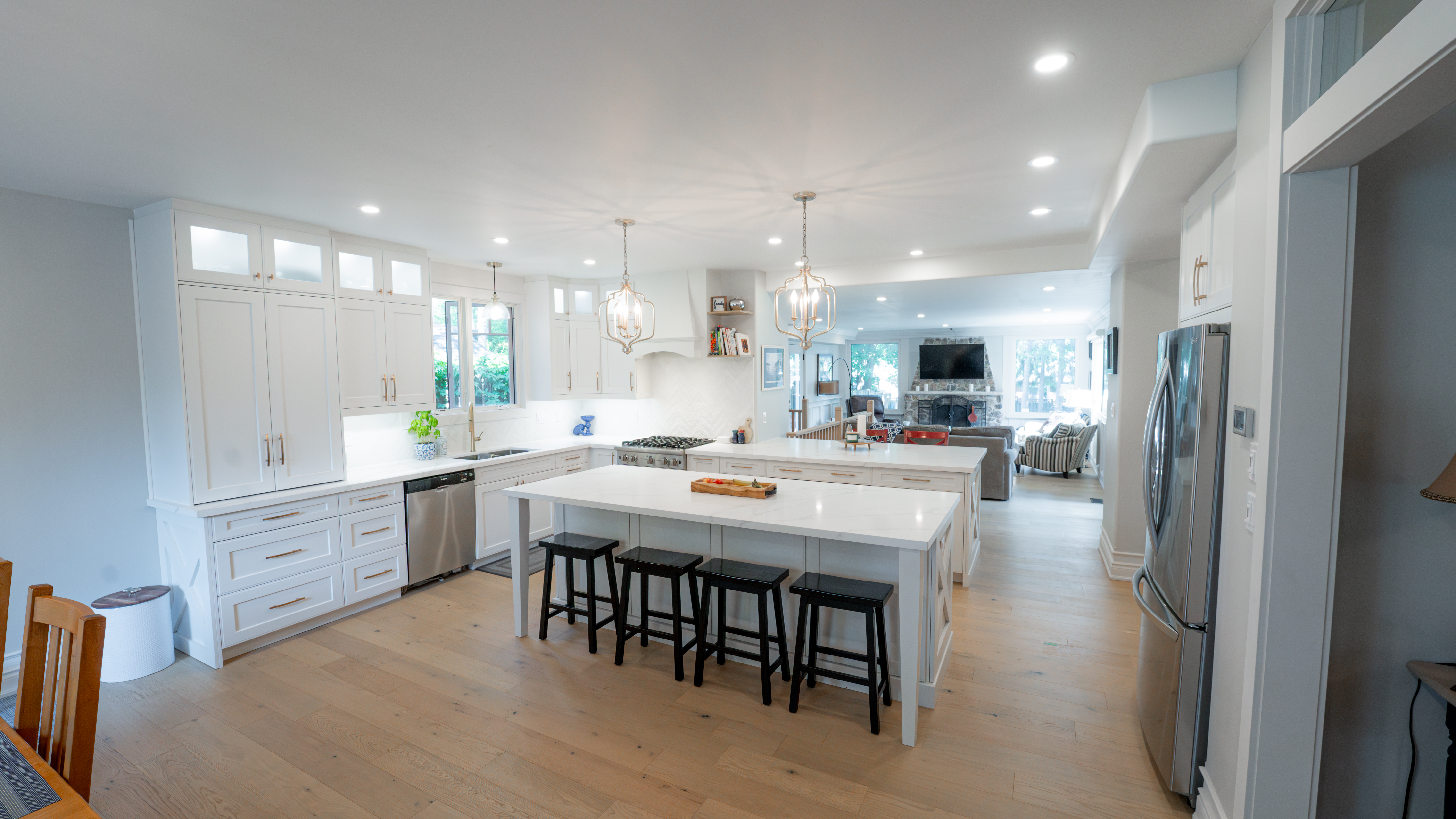 Large white open-concept kitchen with oversized island