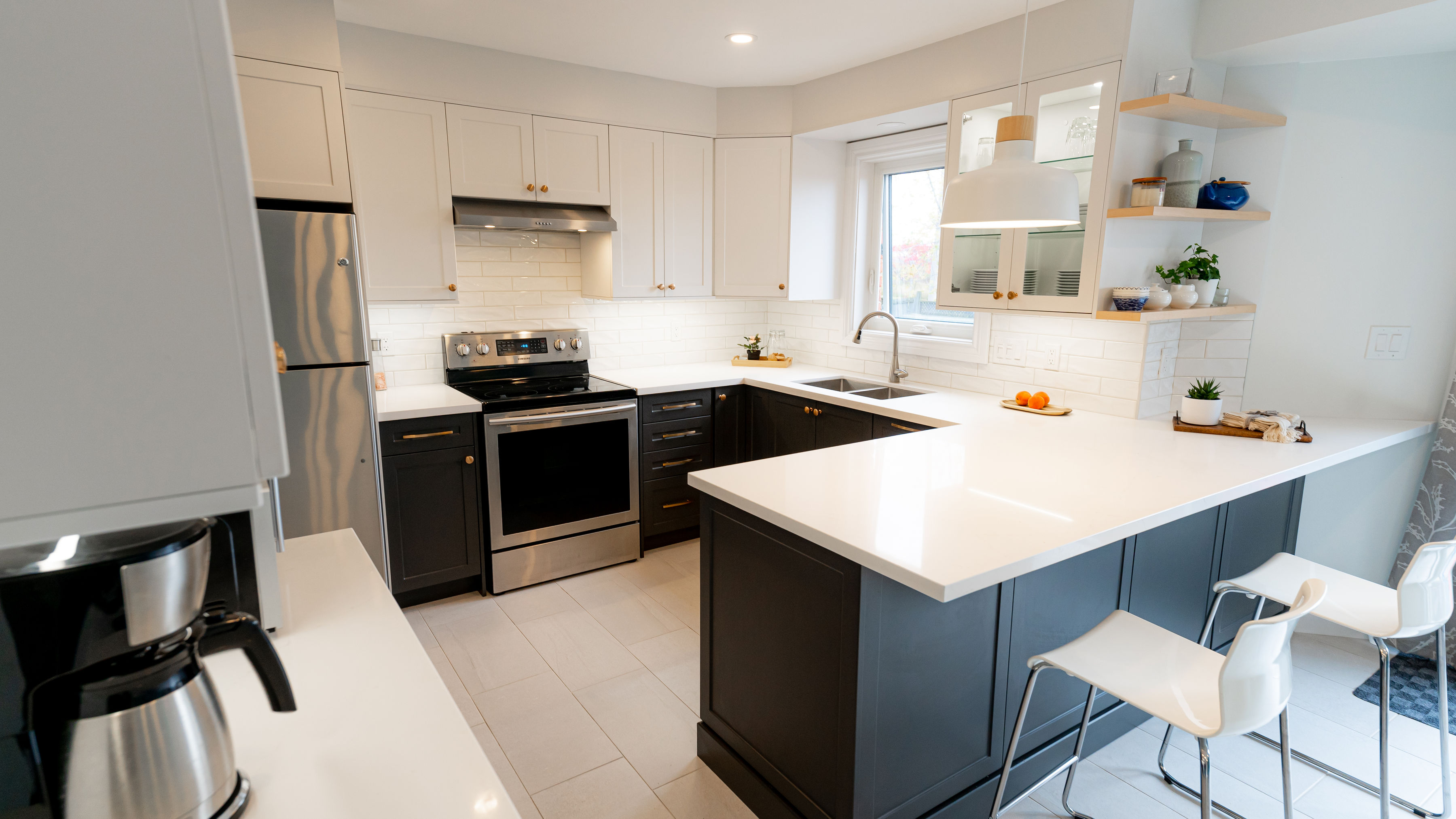 Two-tone kitchen with dark lower and white upper cabinets